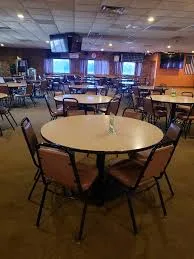Round tables and chairs set out in the Aurora Turners banquet room
