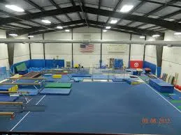 The Aurora Turners gymnastics gym with mats, beams and apparatus set out