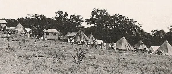 The first cottages appearing in the rustic camp landscape around 1926
