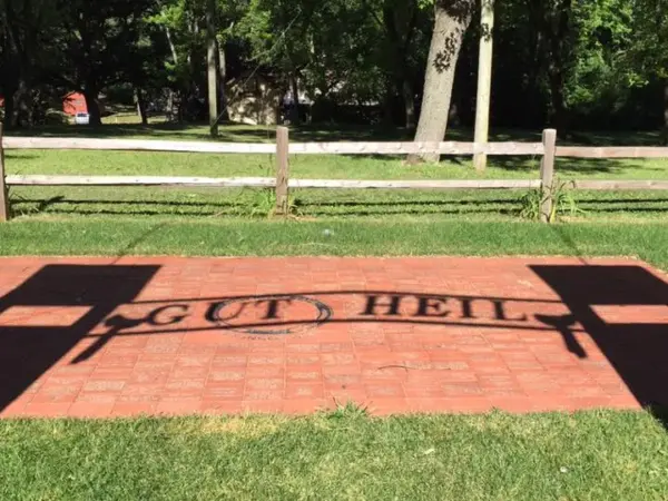 Brick plaza engraved with the words Gut Heil and members' commemorative bricks
